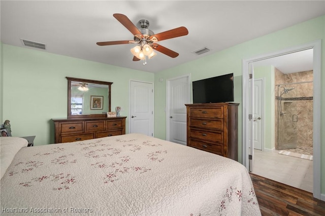 bedroom featuring connected bathroom, ceiling fan, and dark hardwood / wood-style floors