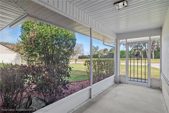 unfurnished sunroom featuring plenty of natural light