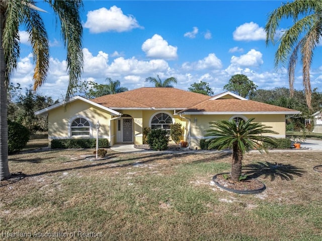 ranch-style house with a front yard