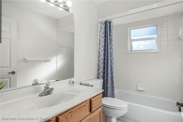 full bathroom featuring vanity, toilet, and shower / bathtub combination with curtain