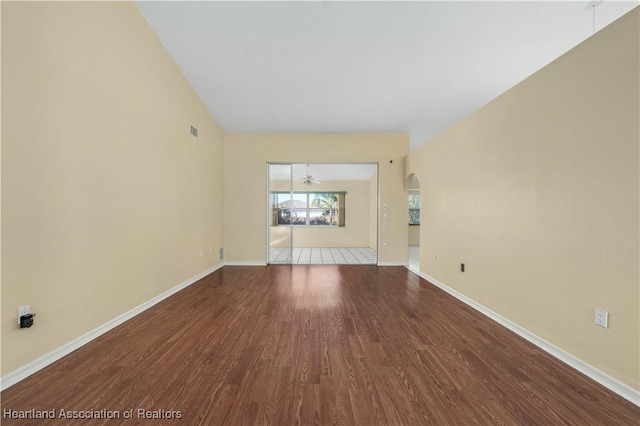 unfurnished living room featuring ceiling fan and hardwood / wood-style floors