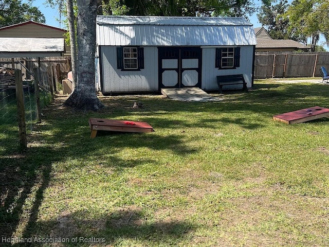 view of shed with a fenced backyard