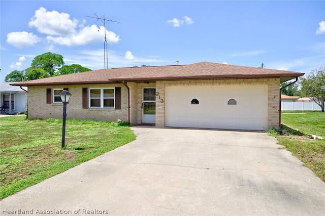 ranch-style house with a front lawn and a garage