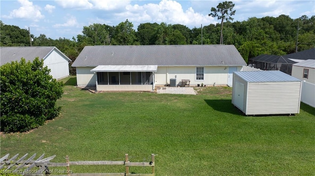2433 N Highlands Blvd, Avon Park, FL 33825 - back of property with a sunroom, a yard, and central AC