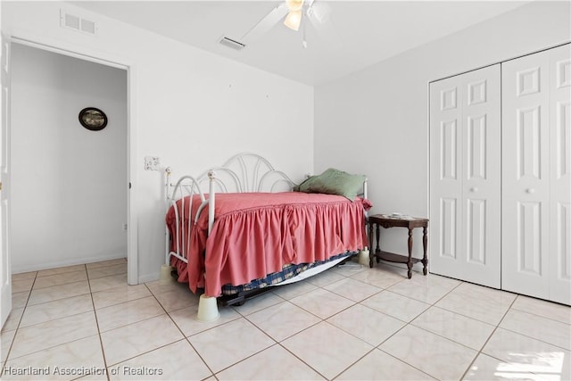 2433 N Highlands Blvd, Avon Park, FL 33825 - bedroom with light tile patterned floors, a closet, a ceiling fan, and baseboards