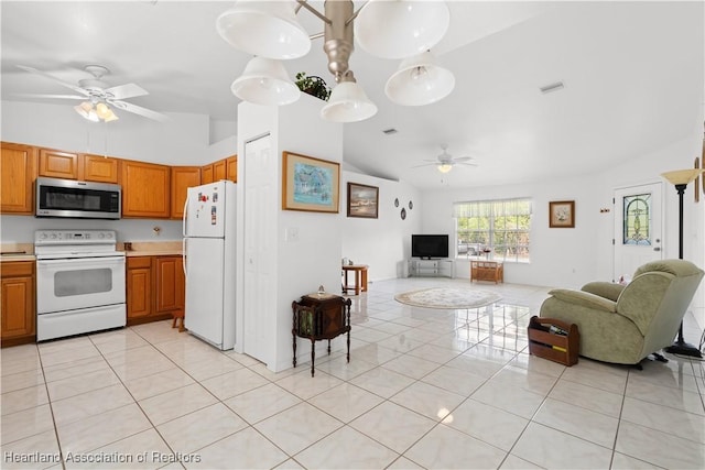 2433 N Highlands Blvd, Avon Park, FL 33825 - kitchen with white appliances, a ceiling fan, open floor plan, light tile patterned flooring, and high vaulted ceiling