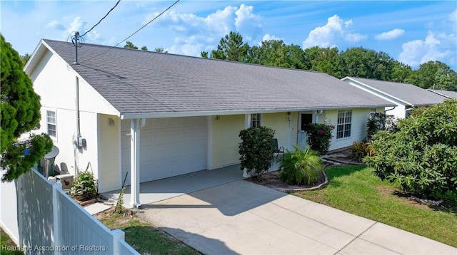 2433 N Highlands Blvd, Avon Park, FL 33825 - ranch-style house featuring an attached garage, driveway, a shingled roof, and stucco siding