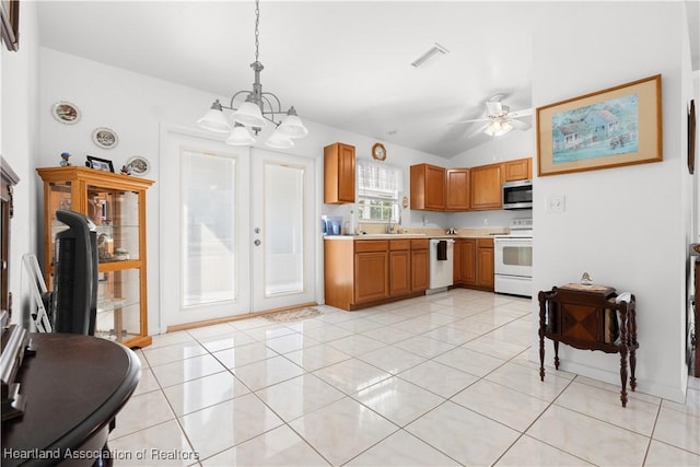 2433 N Highlands Blvd, Avon Park, FL 33825 - kitchen with white electric stove, stainless steel microwave, dishwashing machine, light countertops, and a chandelier