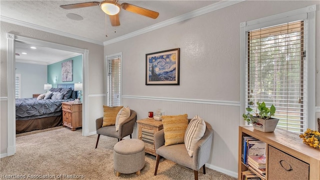 interior space featuring ceiling fan, light colored carpet, and ornamental molding