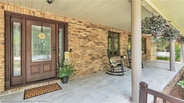 doorway to property with a porch