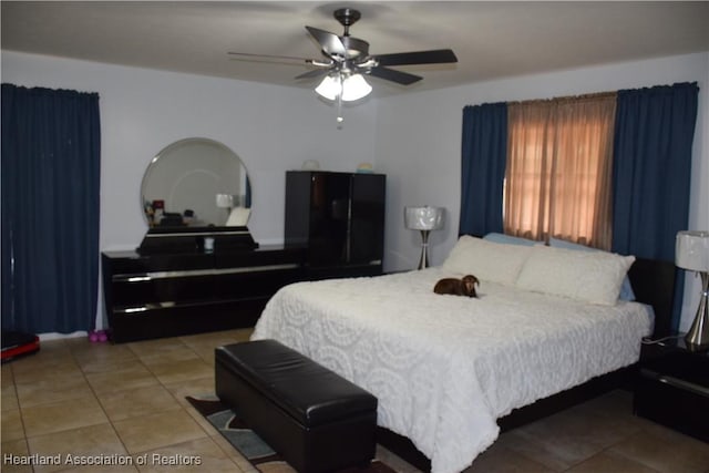 bedroom featuring tile patterned flooring and a ceiling fan