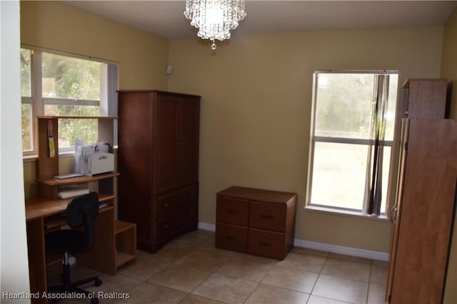 office with an inviting chandelier, plenty of natural light, and baseboards