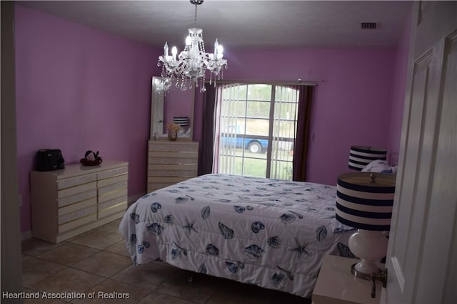bedroom with light tile patterned flooring, visible vents, and an inviting chandelier