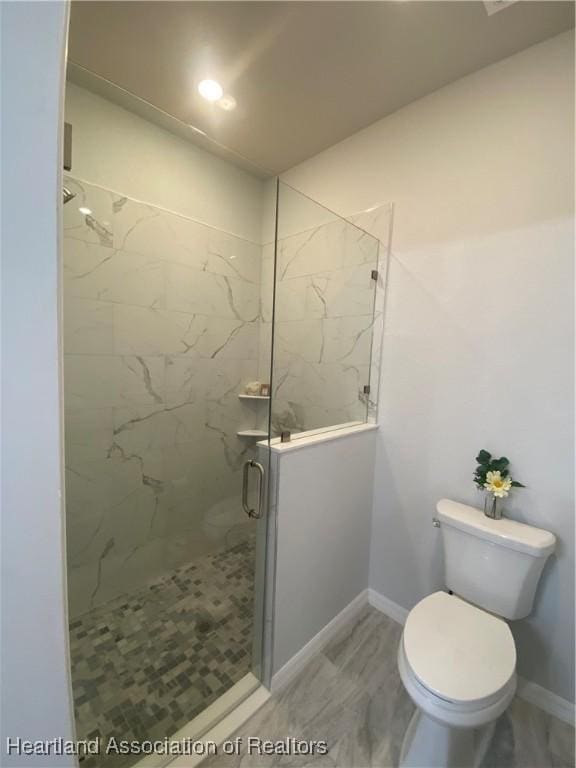 bathroom with toilet and an enclosed shower