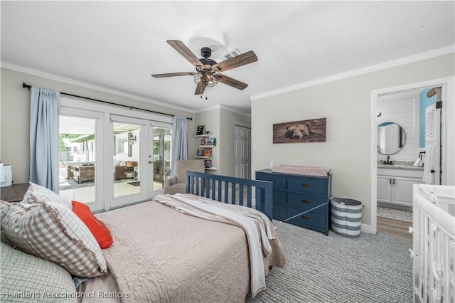 bedroom featuring access to exterior, ceiling fan, french doors, ensuite bathroom, and crown molding