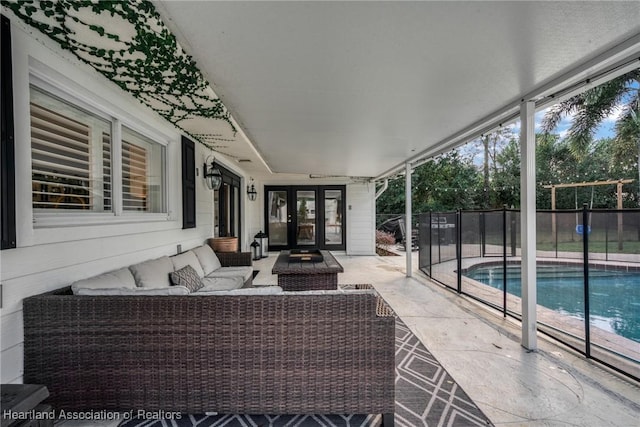 view of patio / terrace featuring a fenced in pool, french doors, and an outdoor hangout area