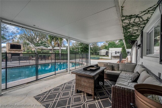 view of patio featuring a fenced in pool and an outdoor hangout area