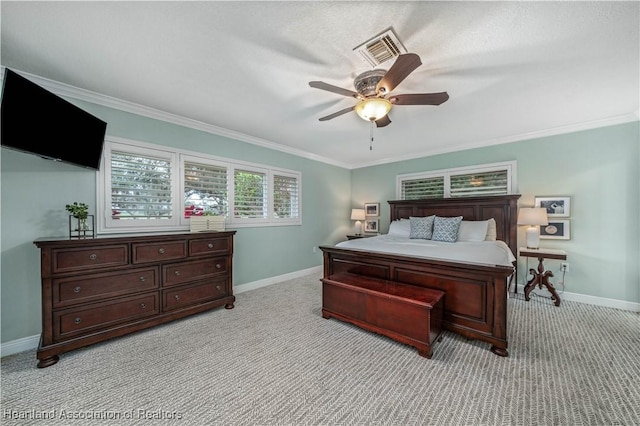 bedroom with ceiling fan, light colored carpet, and ornamental molding