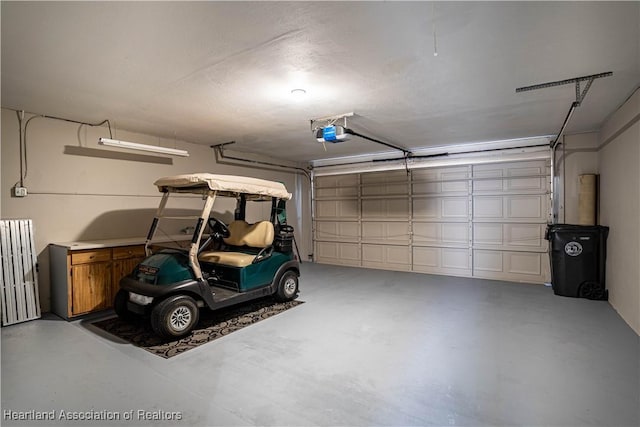 garage featuring a garage door opener