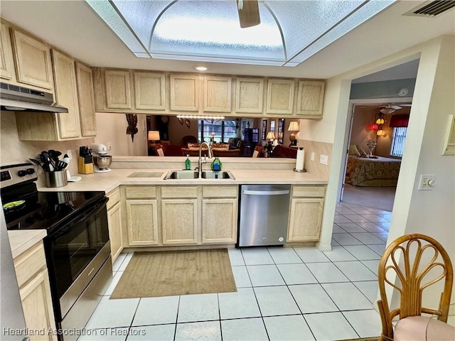 kitchen with ceiling fan, appliances with stainless steel finishes, and light tile patterned flooring