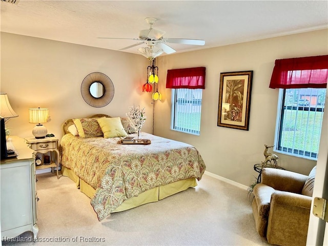 carpeted bedroom with ceiling fan