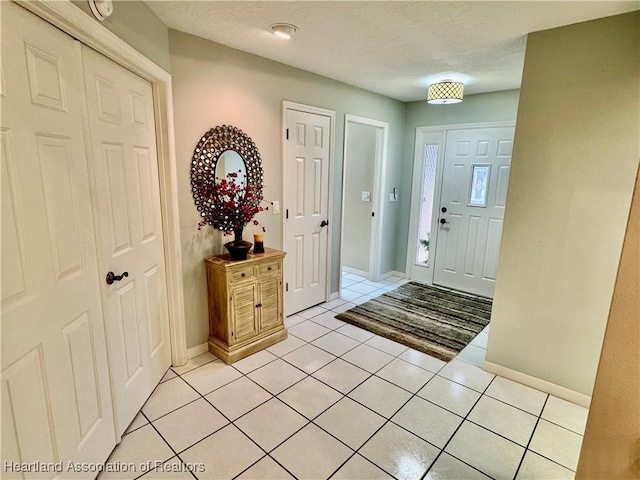 entrance foyer featuring light tile patterned floors