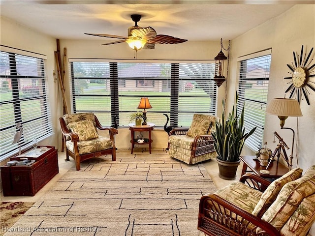 sunroom with ceiling fan