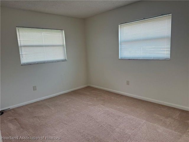 330 Sassafras Ave, Sebring, FL 33870 - spare room featuring carpet floors, baseboards, and a textured ceiling