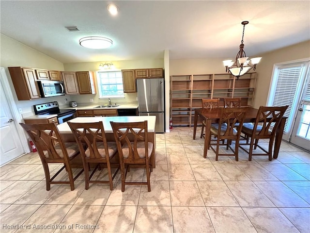 kitchen with light tile patterned floors, visible vents, a sink, light countertops, and appliances with stainless steel finishes