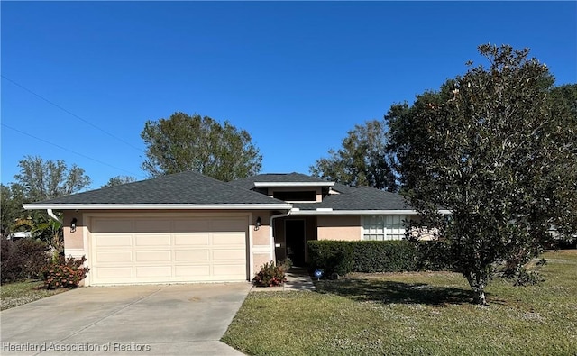 view of front of home with stucco siding, driveway, roof with shingles, a front yard, and a garage