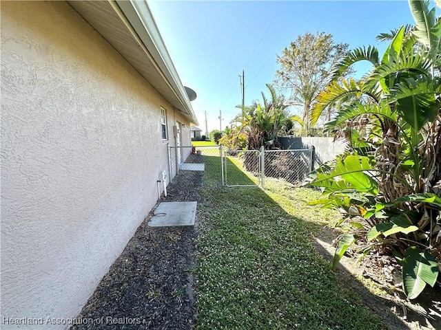 view of yard with a gate and fence