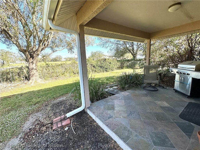 view of patio / terrace featuring fence and grilling area