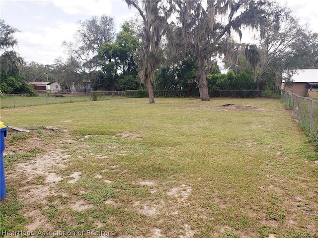 view of yard with a fenced backyard