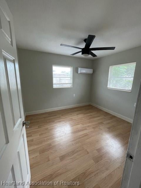 unfurnished room featuring ceiling fan and light hardwood / wood-style floors