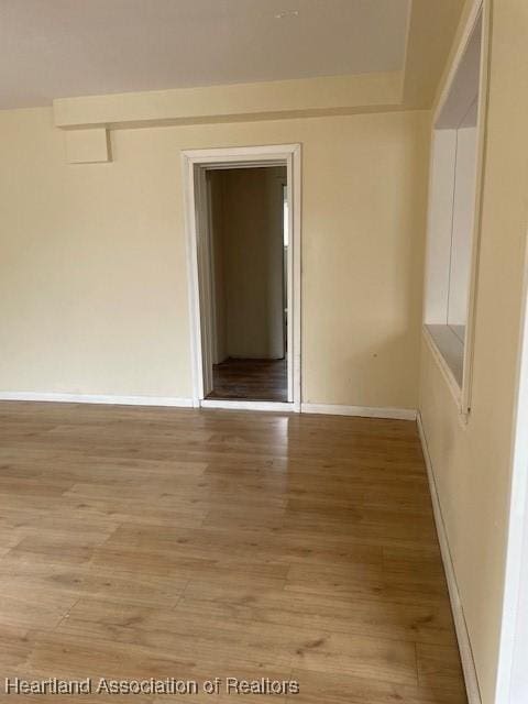 empty room featuring hardwood / wood-style flooring