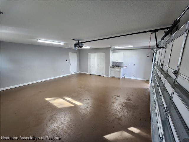 203 Boyer St, Venus, FL 33960 - garage with baseboards and a garage door opener