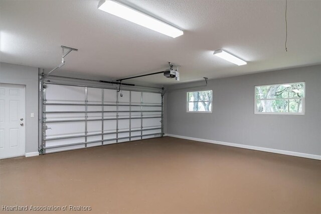 203 Boyer St, Venus, FL 33960 - unfurnished bedroom with baseboards, wood finished floors, multiple windows, and a closet