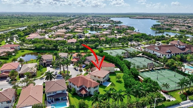 birds eye view of property with a water view