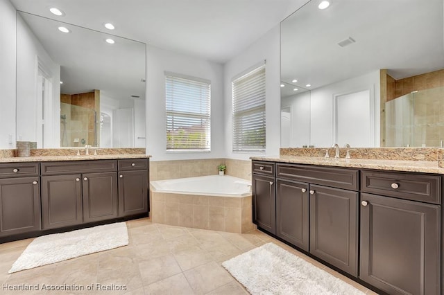 bathroom with vanity, tile patterned floors, and separate shower and tub