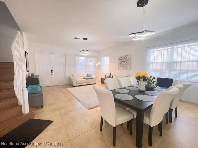 tiled dining area with a healthy amount of sunlight