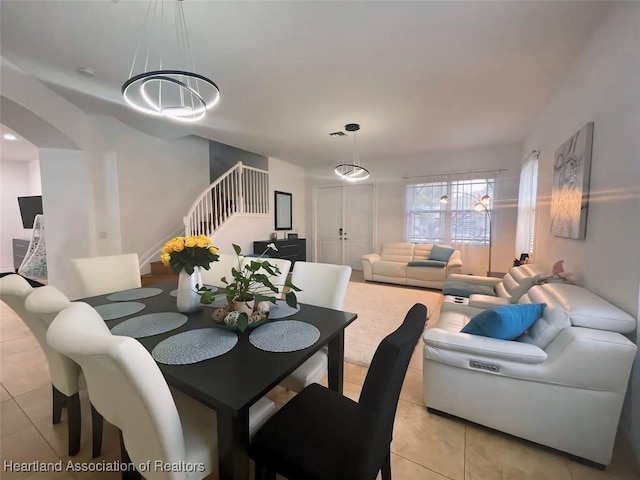 dining space featuring light tile patterned flooring