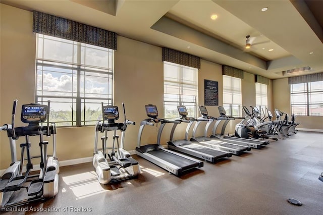 workout area with a raised ceiling