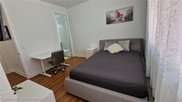 bedroom featuring hardwood / wood-style floors