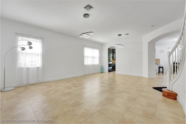 empty room featuring light tile patterned floors