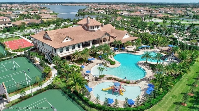 birds eye view of property with a water view