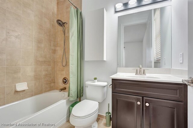 full bathroom with vanity, toilet, and shower / bath combo