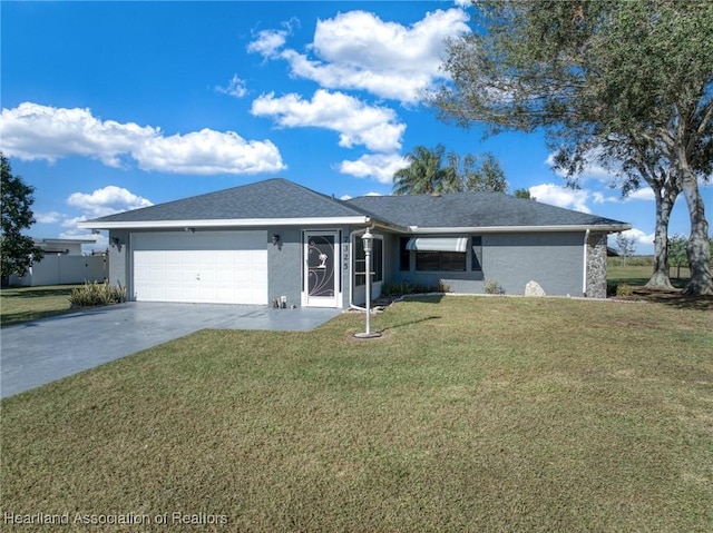 single story home with a front yard and a garage