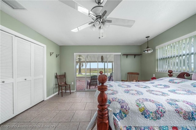tiled bedroom with ceiling fan, access to outside, visible vents, and baseboards
