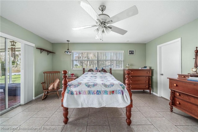 bedroom featuring access to exterior, tile patterned flooring, baseboards, and a ceiling fan