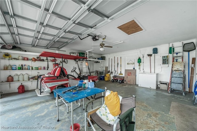 garage featuring a garage door opener and electric panel